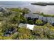 Overhead angle of the condo featuring ample parking, lush trees, and manicured landscape at 1111 N Bayshore Blvd # F11, Clearwater, FL 33759