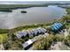 Stunning aerial view of waterfront condos, showcasing serene water views and lush greenery at 1111 N Bayshore Blvd # F11, Clearwater, FL 33759