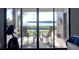 Balcony view shows a table with chairs overlooking the outdoor scenery at 1111 N Bayshore Blvd # F11, Clearwater, FL 33759