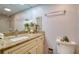 Stylish bathroom featuring granite countertop and a large mirror, combining functionality with elegant design at 1111 N Bayshore Blvd # F11, Clearwater, FL 33759