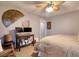 Inviting bedroom with a comfortable bed, ample workspace featuring dual monitors, and charming decor at 1111 N Bayshore Blvd # F11, Clearwater, FL 33759