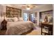 Well-lit bedroom featuring a spacious bed, complemented by a large window and desk space for a productive environment at 1111 N Bayshore Blvd # F11, Clearwater, FL 33759