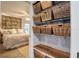 View of an organized closet and a cozy bedroom with a comfortable bed and bright light from windows at 1111 N Bayshore Blvd # F11, Clearwater, FL 33759