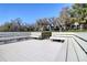 Spacious deck with built-in seating, surrounded by lush landscaping and serene waterfront views at 1111 N Bayshore Blvd # F11, Clearwater, FL 33759