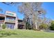 Lovely multi-story home with multiple balconies and a manicured lawn featuring mature trees at 1111 N Bayshore Blvd # F11, Clearwater, FL 33759