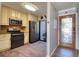 Modern kitchen with stainless steel appliances, granite countertops, and stylish cabinetry at 1111 N Bayshore Blvd # F11, Clearwater, FL 33759
