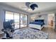 Relaxing main bedroom features blue accents, sliding glass doors, and a ceiling fan at 1111 N Bayshore Blvd # F11, Clearwater, FL 33759