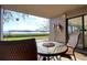 Outdoor patio with seating offers serene views of the water, creating a perfect space for relaxation and enjoyment at 1111 N Bayshore Blvd # F11, Clearwater, FL 33759