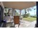 Relaxing patio with comfortable seating overlooking beautiful landscaping and serene waterfront views at 1111 N Bayshore Blvd # F11, Clearwater, FL 33759