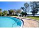 Inviting swimming pool with clear blue water and comfortable seating overlooking the beautiful lake at 1111 N Bayshore Blvd # F11, Clearwater, FL 33759