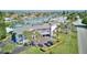 Aerial view of a waterfront condo building with boats, palm trees, and beautiful water at 12055 3Rd E St # 103, Treasure Island, FL 33706