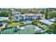 Beautiful condo complex featuring waterfront access, a community pool, and lush landscaping at 12055 3Rd E St # 103, Treasure Island, FL 33706