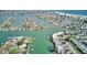 Panoramic aerial view of the waterfront community, displaying the network of waterways and residential properties with Gulf access at 12055 3Rd E St # 103, Treasure Island, FL 33706