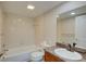 A bright bathroom features a tub and shower combo with granite countertop and modern faucet at 12055 3Rd E St # 103, Treasure Island, FL 33706