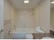 The bathroom has a tub and shower combo with granite countertop at 12055 3Rd E St # 103, Treasure Island, FL 33706