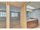 Bathroom featuring a vanity with granite countertop and view to carpeted bedroom at 12055 3Rd E St # 103, Treasure Island, FL 33706