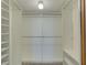 Walk-in closet with built-in shelving and hanging rods for optimal storage at 12055 3Rd E St # 103, Treasure Island, FL 33706
