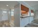 Bright kitchen pass-through with granite counter and stainless sink at 12055 3Rd E St # 103, Treasure Island, FL 33706