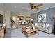 Well-lit open-concept living room and dining area with comfortable seating at 12055 3Rd E St # 103, Treasure Island, FL 33706