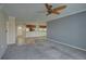Bright, open-concept living room with a view of the kitchen and dining area at 12055 3Rd E St # 103, Treasure Island, FL 33706