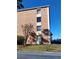 Exterior shot of building number 10 with well-maintained landscaping in front and visible parking at 12760 Indian Rocks Rd # 1066, Largo, FL 33774