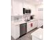 Updated kitchen featuring stainless steel appliances and white cabinets at 12760 Indian Rocks Rd # 1066, Largo, FL 33774
