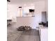 Bright living room featuring modern gray flooring and decor at 12760 Indian Rocks Rd # 1066, Largo, FL 33774