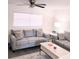 Comfortable living room with modern furniture, ceiling fan and a large window with bright, natural light at 12760 Indian Rocks Rd # 1066, Largo, FL 33774