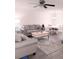 Inviting living room and dining area featuring contemporary furniture, a ceiling fan and a neutral color palette at 12760 Indian Rocks Rd # 1066, Largo, FL 33774
