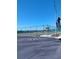 Well-maintained tennis court with surrounding fence and convenient parking area at 12760 Indian Rocks Rd # 1066, Largo, FL 33774
