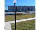 View of community tennis courts and waterfront apartment complex at 12760 Indian Rocks Rd # 1066, Largo, FL 33774