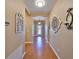 Inviting hallway featuring decorative accents and elegant tile flooring at 1510 Yale Castle Ct, Ruskin, FL 33570