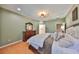 Cozy bedroom features an elegant dresser, neutral-toned walls, and a door leading to the bathroom at 1510 Yale Castle Ct, Ruskin, FL 33570