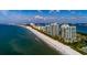 Beautiful coastline featuring beachfront condos, sandy beach, and clear ocean waters at 1560 Gulf Blvd # 1104, Clearwater Beach, FL 33767