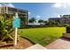 Well-kept croquet court with manicured lawn and clear signage, surrounded by lush landscaping and palms at 1560 Gulf Blvd # 1104, Clearwater Beach, FL 33767