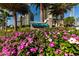 Ultimar entrance sign surrounded by flowers and palm trees showcasing the building in the background on a sunny day at 1560 Gulf Blvd # 1104, Clearwater Beach, FL 33767