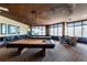 Game room with two pool tables, bar seating, and ocean views at 1560 Gulf Blvd # 1104, Clearwater Beach, FL 33767