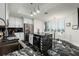 Elegant kitchen with black marble island and stainless steel appliances combines style and functionality at 1560 Gulf Blvd # 1104, Clearwater Beach, FL 33767