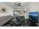 Stylish living room with black marble flooring, ocean views, and comfortable seating offers a sophisticated space at 1560 Gulf Blvd # 1104, Clearwater Beach, FL 33767