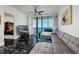 Beautifully appointed living room with ocean views, marble floors, and comfortable seating at 1560 Gulf Blvd # 1104, Clearwater Beach, FL 33767
