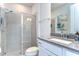 Bathroom featuring a glass-enclosed shower and white vanity with gray countertop at 17805 Everlong Dr, Land O Lakes, FL 34638