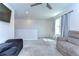 Upstairs bonus room with neutral carpeting, recessed lighting, and a comfortable seating area at 17805 Everlong Dr, Land O Lakes, FL 34638