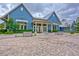 Charming blue clubhouse exterior with well-maintained landscaping at 17805 Everlong Dr, Land O Lakes, FL 34638