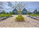Charming blue community center with inviting benches and manicured landscaping, perfect for gatherings at 17805 Everlong Dr, Land O Lakes, FL 34638
