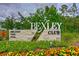 A well-maintained Bexley Club sign with beautiful landscaping, showcasing the community's amenities at 17805 Everlong Dr, Land O Lakes, FL 34638