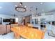 Open concept dining area, with a view into the living room and kitchen with stainless steel appliances at 17805 Everlong Dr, Land O Lakes, FL 34638