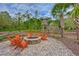 Inviting outdoor fire pit area with Adirondack chairs, perfect for relaxation and social gatherings at 17805 Everlong Dr, Land O Lakes, FL 34638