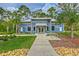 Inviting exterior of a fitness center, featuring lush landscaping and a modern building design at 17805 Everlong Dr, Land O Lakes, FL 34638