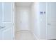 Bright foyer with white walls, tile flooring, and a modern security system panel at 17805 Everlong Dr, Land O Lakes, FL 34638