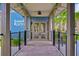 Welcoming entrance to the game room, featuring a covered walkway and lush landscaping at 17805 Everlong Dr, Land O Lakes, FL 34638